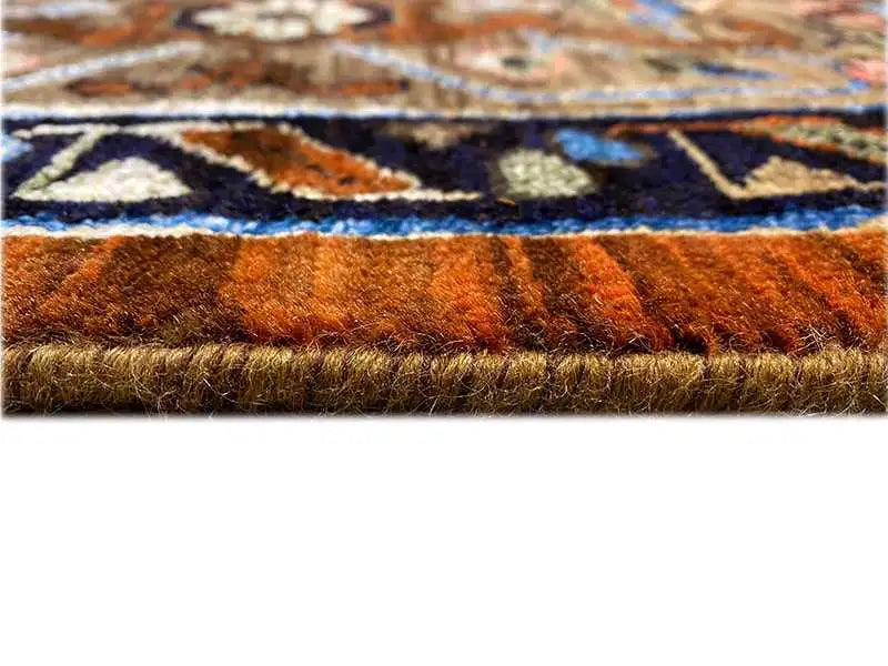 Carpet pile in detail: reddish-brown fibers with a colorful pattern underneath