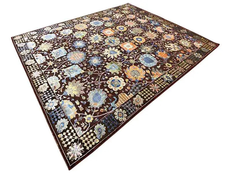 Designer rug with a colorful floral and medallion pattern in brown, blue, and cream