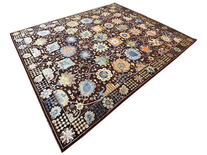 Designer rug with a colorful floral and medallion pattern in brown, blue, and cream