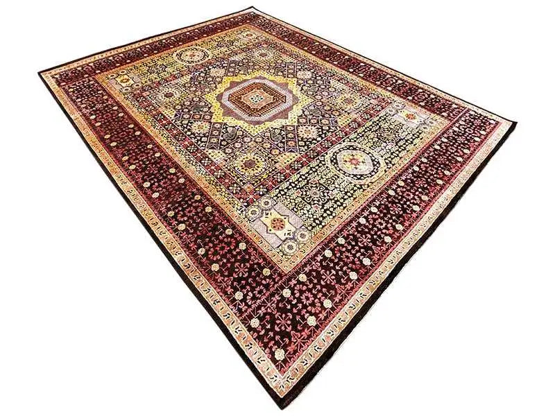 Rug with a square pattern and central medallion in red, beige, and dark brown