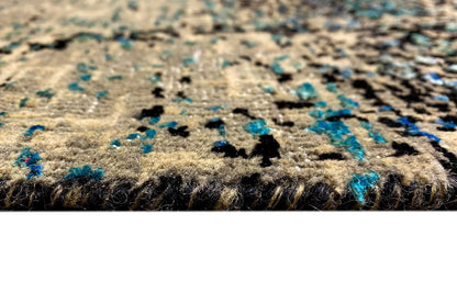 Close-up of a designer rug: texture with short pile fibers and a blue accent in the pattern