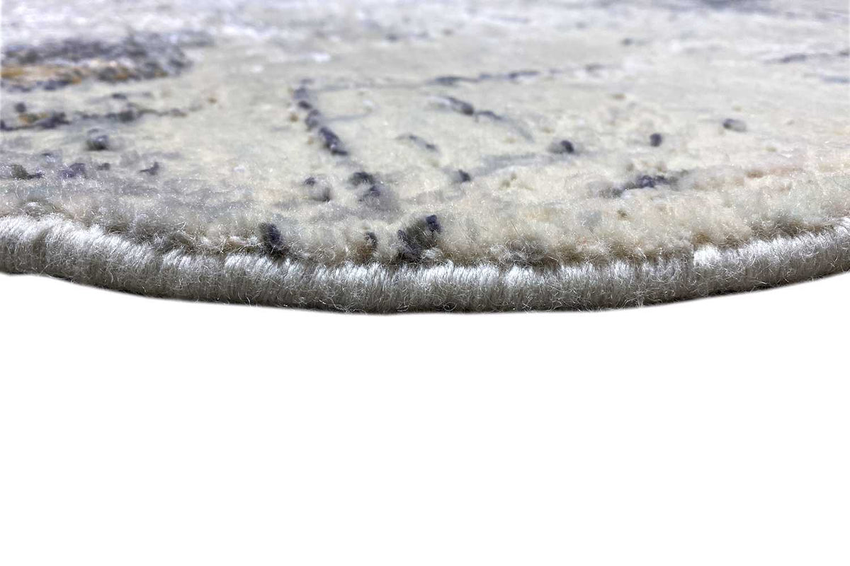 Close-up of the carpet edge and pile, beige-gray pile with a dense edge