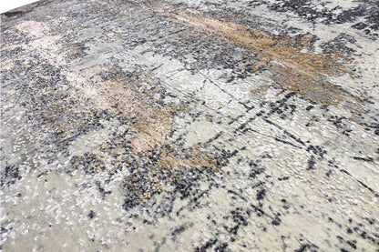 Detail of the carpet surface with an abstract pattern in light beige, gray, and brown