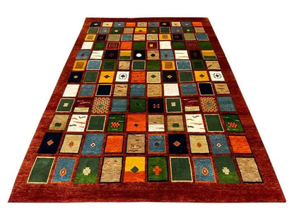 Gabbeh rug “Lori” (256x196 cm) with a square patchwork pattern in red, green and blue
