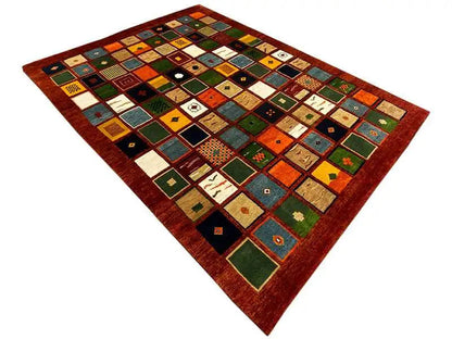 Gabbeh rug “Lori” with rectangular patchwork of colorful squares, red border