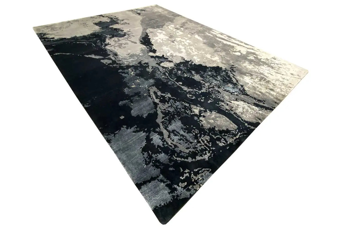 Square rug with dark and light gray tones, abstract speckled look