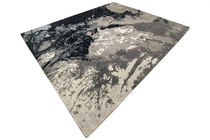 Square rug: light gray and dark blue with an abstract, cloud-like pattern