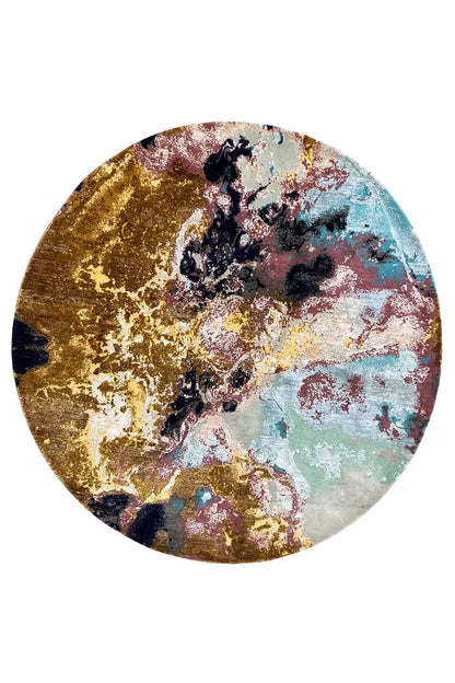 Round rug with an abstract design in gold, dark blue, pink, and light blue