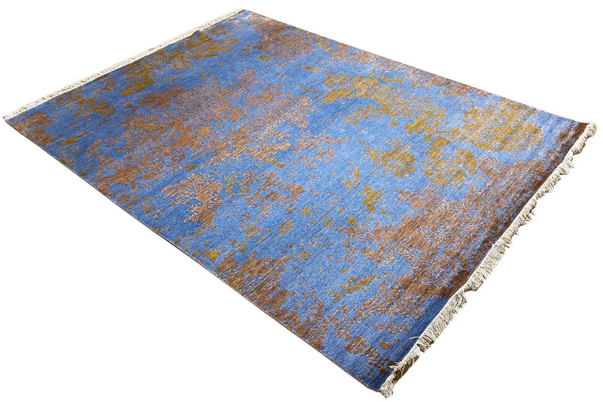 Rug 365 x 275 cm, blue-and-gold ornamental design, spread out diagonally