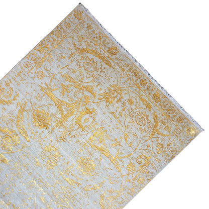 Designer rug 316x245 cm, diagonal view, gold-colored pattern on a light background