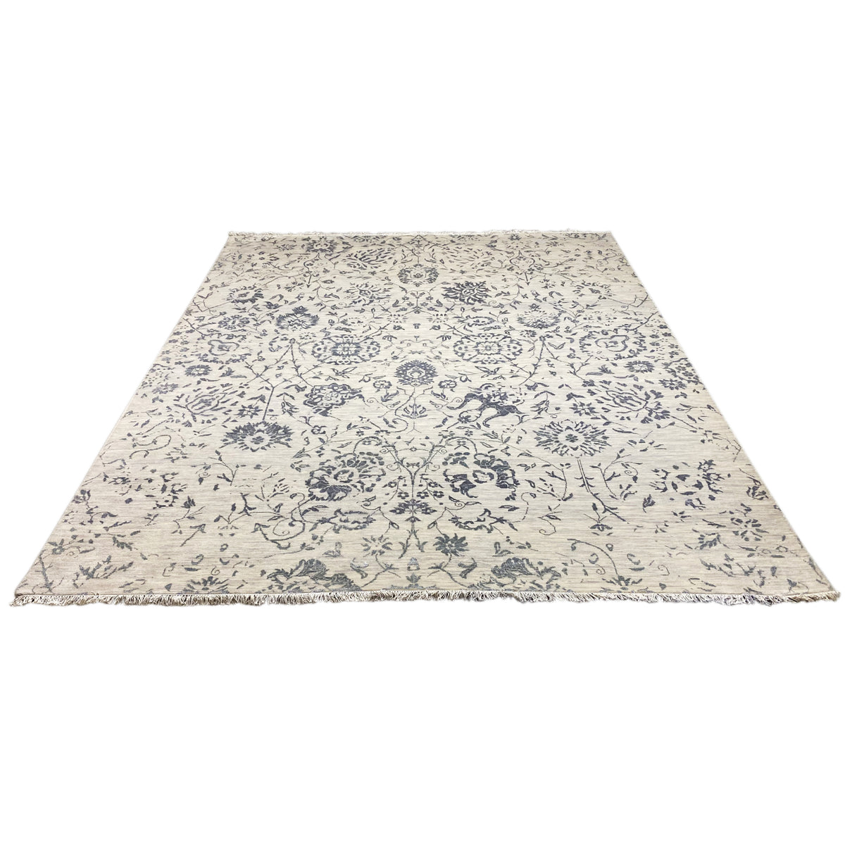 Rectangular designer rug with blue and light-colored ornaments, lying flat