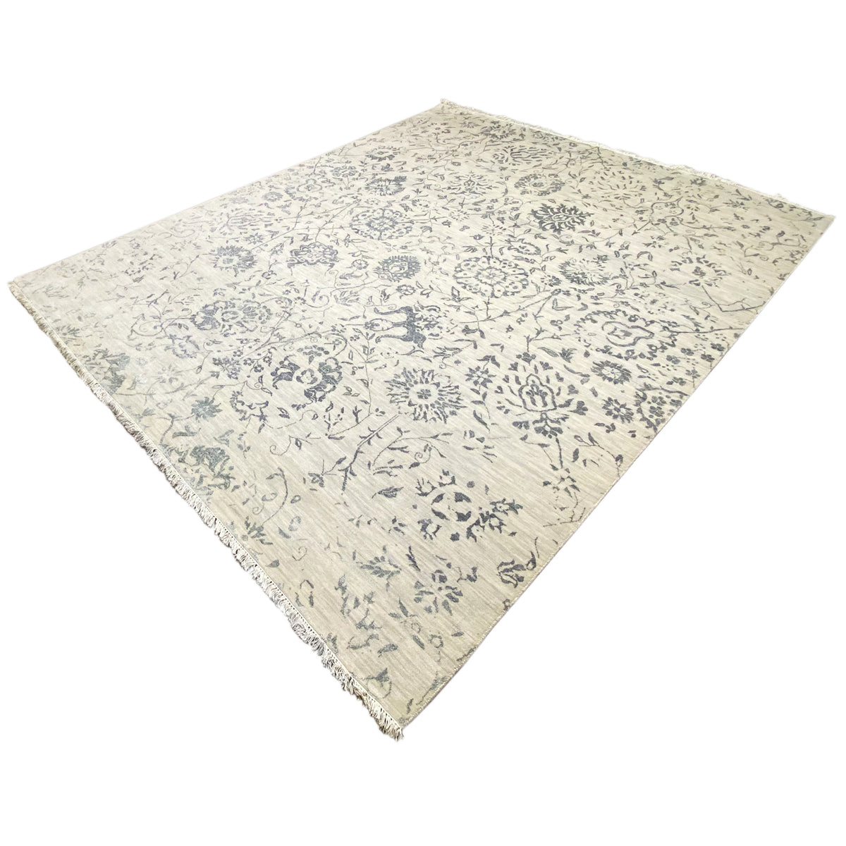 Light designer rug with blue ornamental print, corner view, fine border