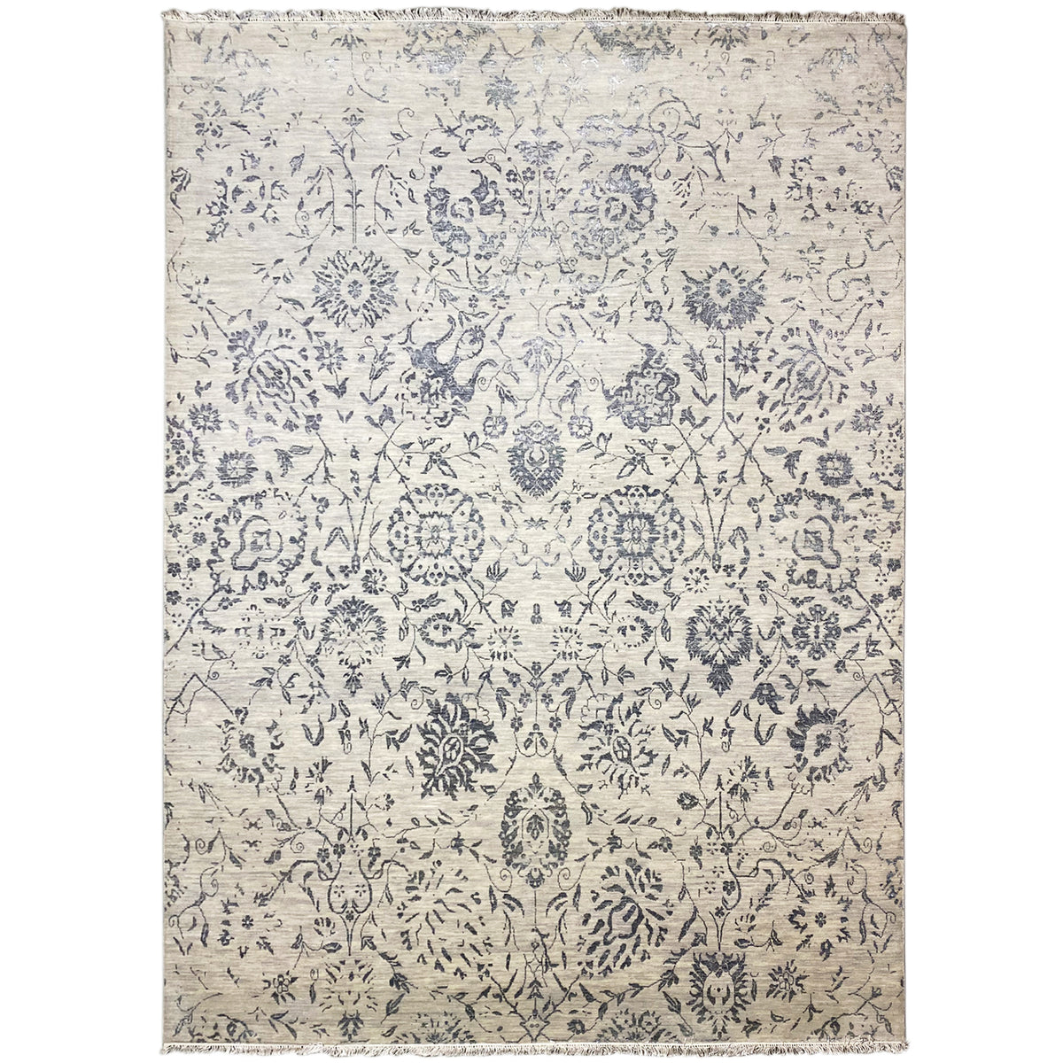 Designer rug with a blue ornamental pattern on a light background, rectangular, with bound edges