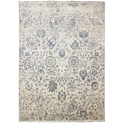 Designer rug with a blue ornamental pattern on a light background, rectangular, with bound edges