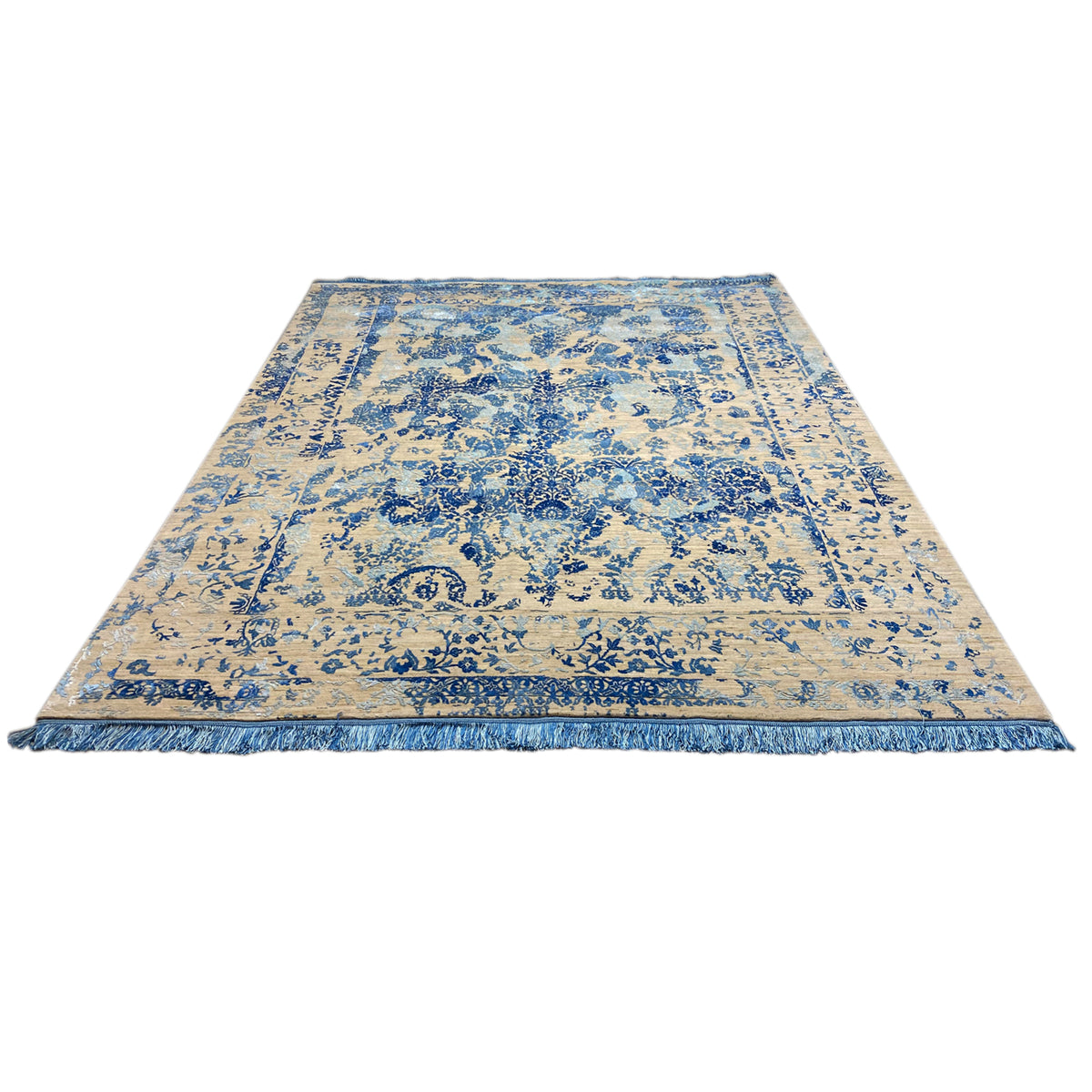 Designer rug with a beige background and blue pattern, laid flat