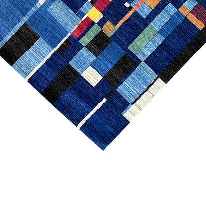 Hand-knotted Gabbeh rug, diagonal view of blue pattern with contrasting stripes