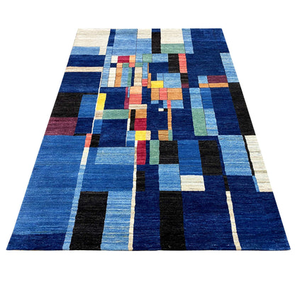 Hand-knotted blue Gabbeh rug with geometric patchwork and colorful blocks of color