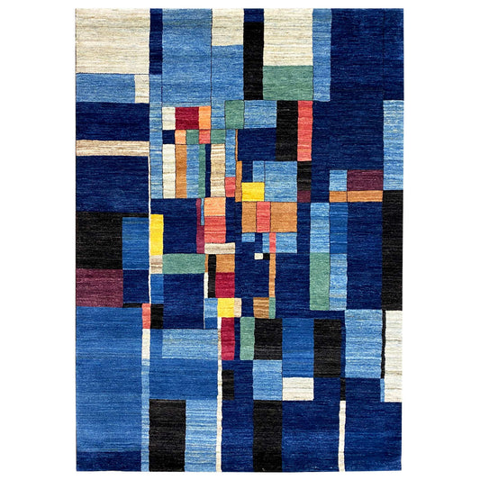 Hand-knotted Gabbeh rug with a blue patchwork pattern and multicolored accents