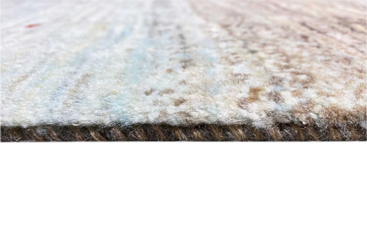 Gabbeh rug close-up: short pile with a frayed-looking selvedge