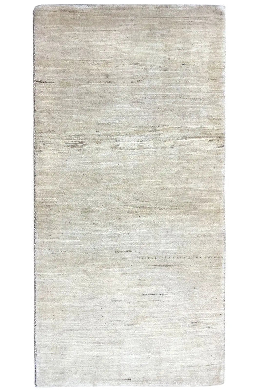 Rectangular light beige Gabbeh rug, straight edges, fine lines, and even texture