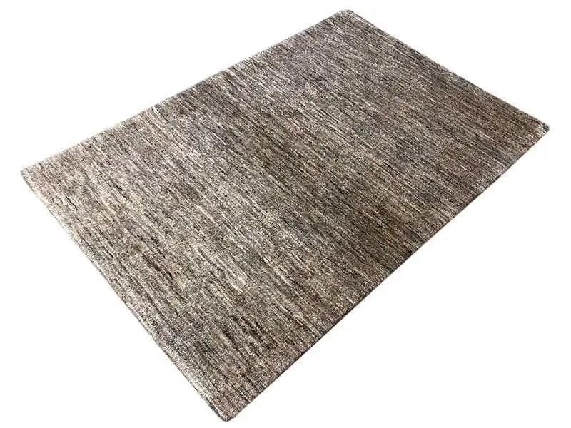 Rectangular rug with a mottled gray-brown woven pattern and short pile