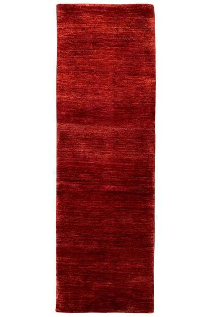 Reddish-brown Gabbeh runner, rectangular shape, even pile height