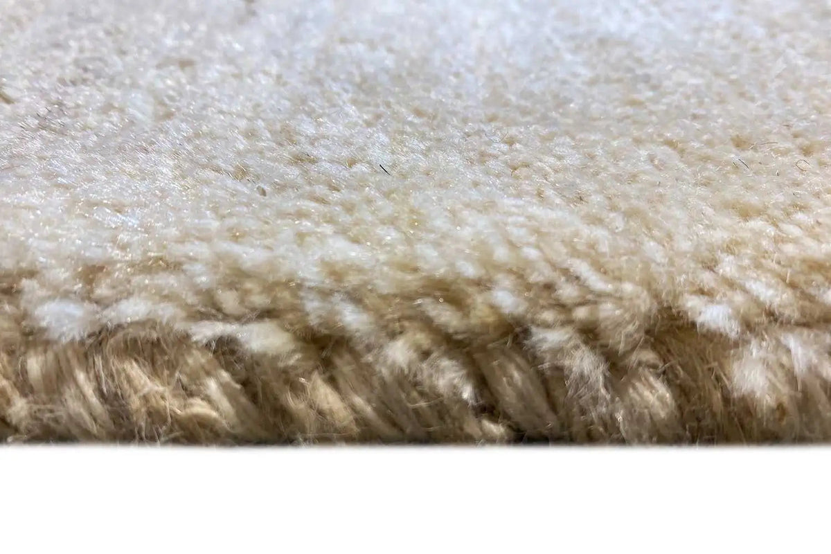 Gabbeh rug close-up, natural beige pile, dense border with short fibers
