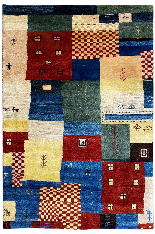 Gabbeh rug with colorful block patterns and decorative small symbols