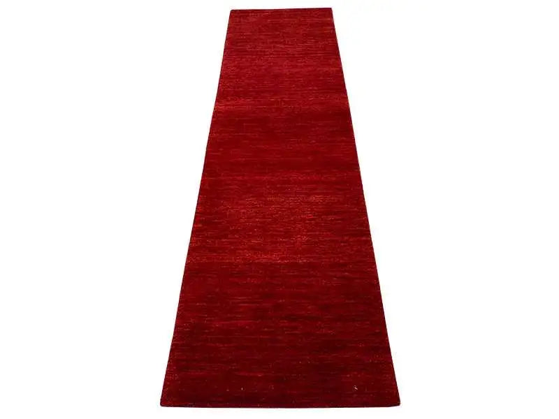 Runner rug in bold red, elongated rectangular shape