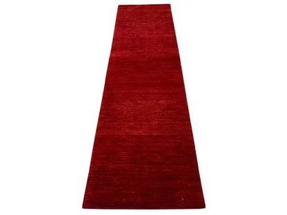 Runner rug in bold red, elongated rectangular shape