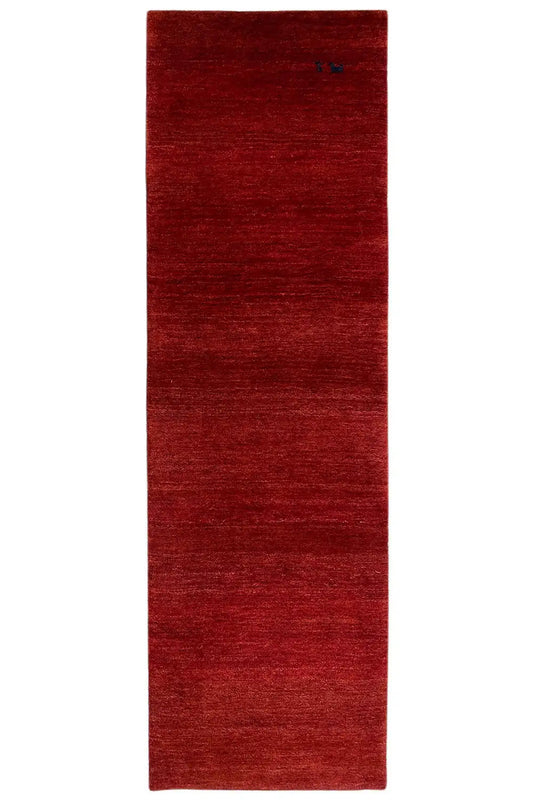 Rectangular burgundy rug with a fine pile texture