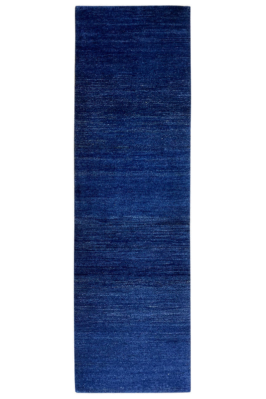 Narrow blue runner rug with a dense, even weave texture