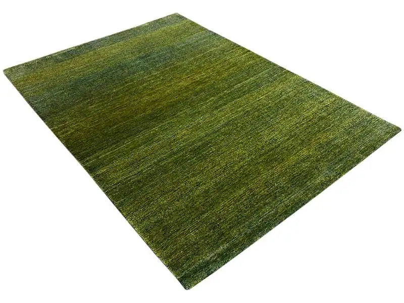 Gabbeh rug, green mottled pile with an even all-over pattern
