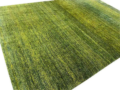 Gabbeh rug detail: green, mottled pile with a fine, directional-looking pattern