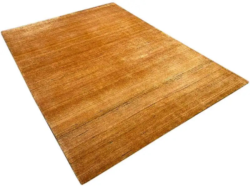 Gabbeh rug Gold, diagonal view with a warm honey tone and fine woven texture