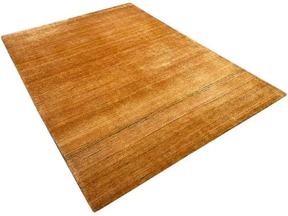 Gabbeh rug Gold, diagonal view with a warm honey tone and fine woven texture
