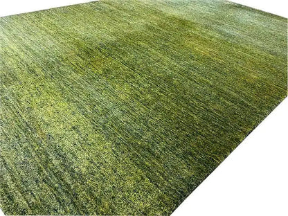 Gabbeh rug in green, fine flat texture with mottled color tones