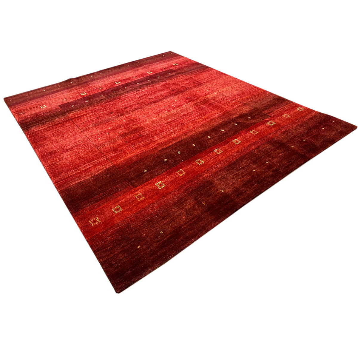 Hand-knotted Gabbeh rug with a red geometric pattern, spread diagonally, golden squares
