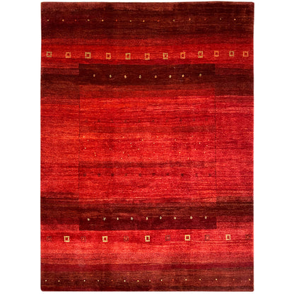 Hand-knotted Gabbeh rug with a red pattern, dark border, and gold accents