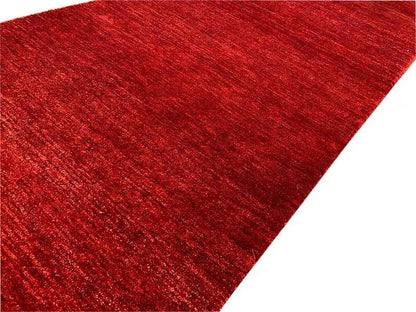 Gabbeh runner rug, dark red mottled finish with a fine pile texture