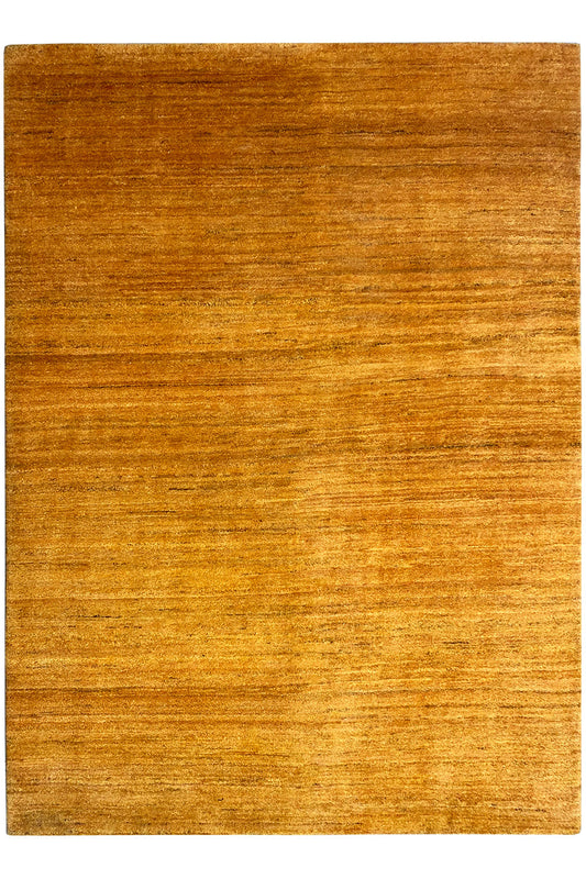 Rectangular Gabbeh rug, honey-brown surface with a fine, even weave.