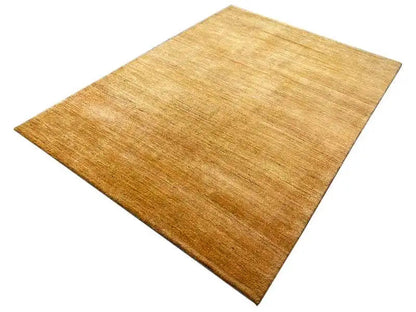 Gabbeh rug 237x168 cm, golden-brown pile with an even weave.