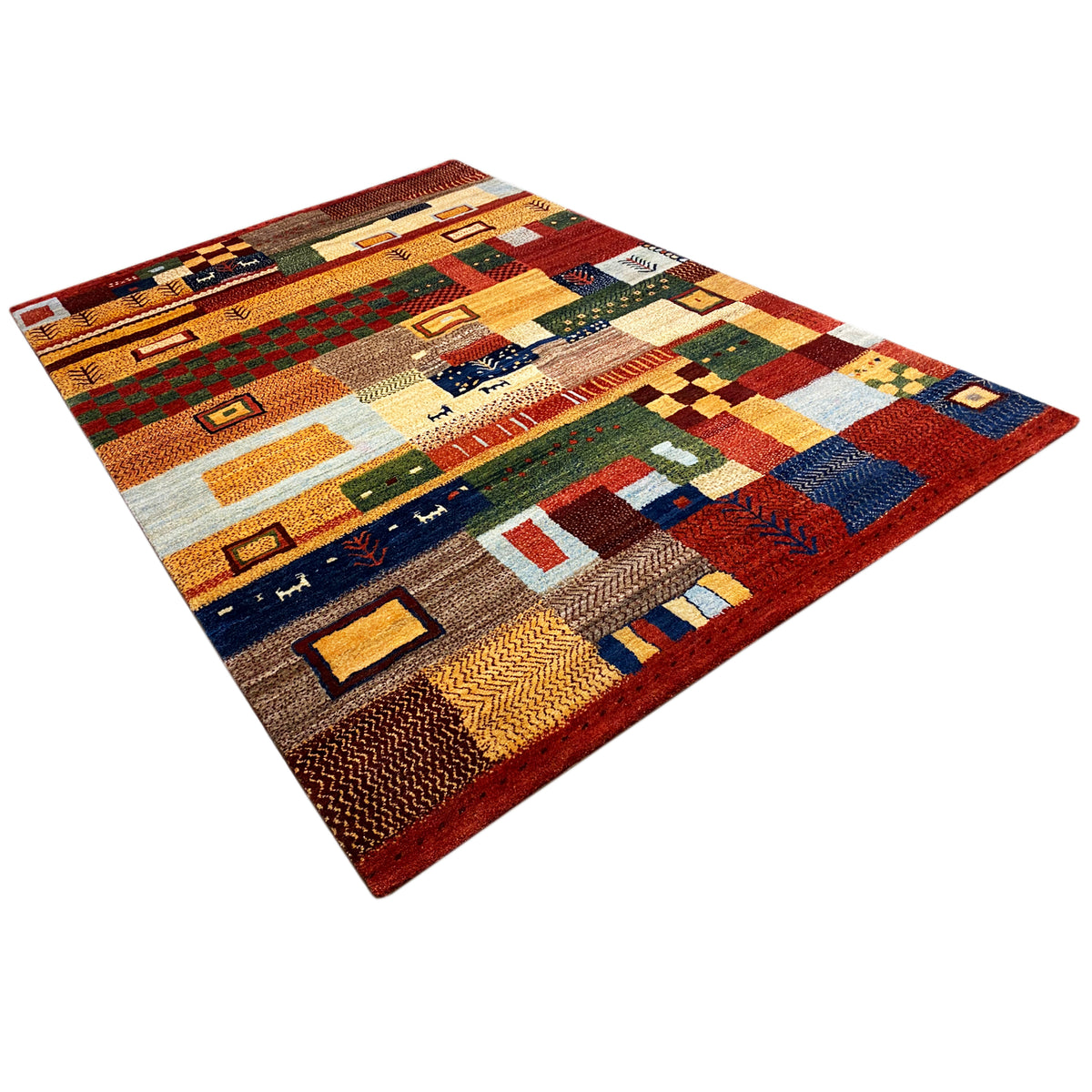 Gabbeh rug with a colorful patchwork design of rectangles and ornaments, 3/4 view
