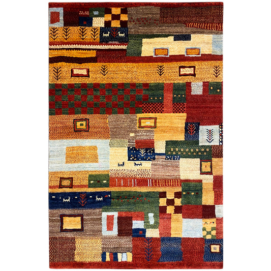 Hand-knotted Gabbeh rug with geometric patchwork in red, yellow, blue, and green