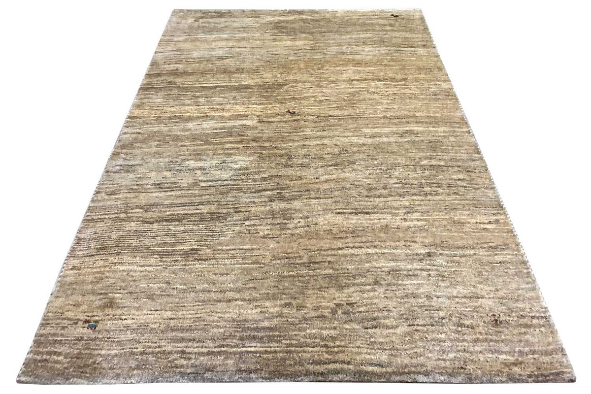Gabbeh rug with a narrow linear texture, beige pile, and subtle colored dots