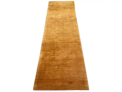 Gabbeh runner rug in honey brown with a fine, even weave.