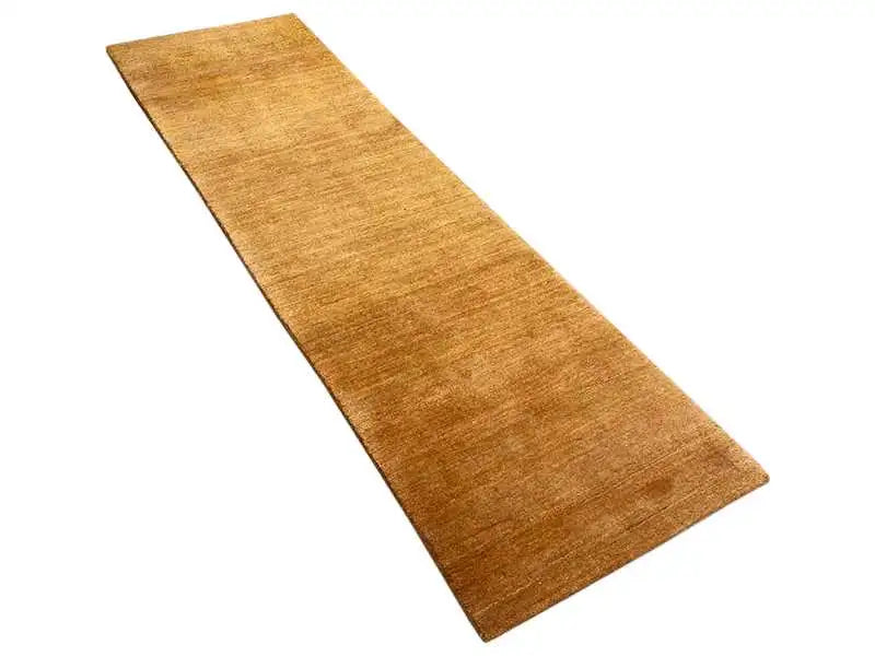 Honey-brown runner rug with a low pile and clean edges.
