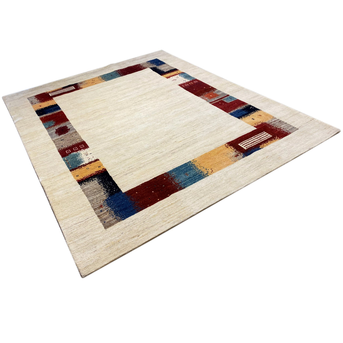 Hand-knotted Gabbeh rug with a rectangular central motif in cream and colorful border elements