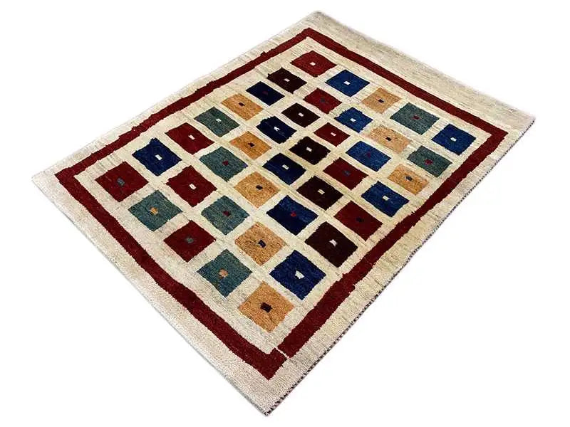 Gabbeh rug with a square tile pattern in beige, blue, red and green