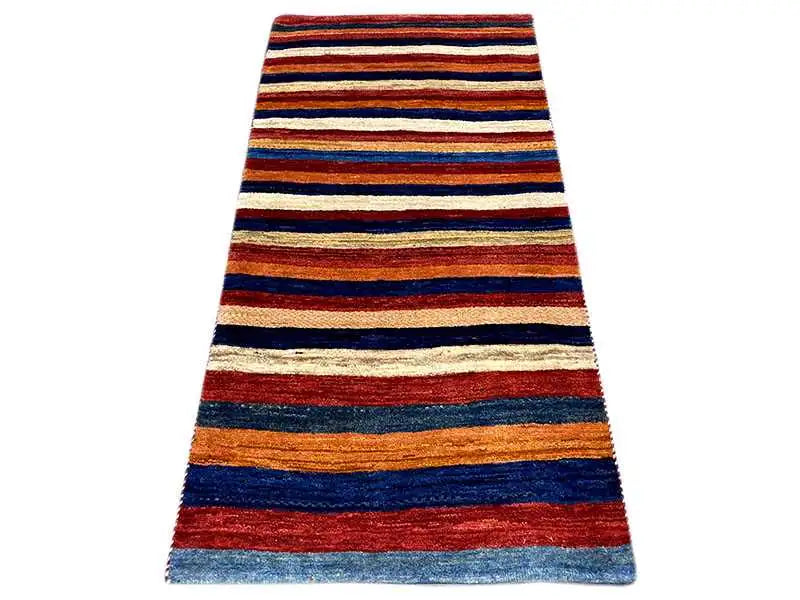 Gabbeh rug with a striped pattern in red, blue, and cream